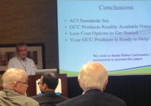 Huber's Lane Shaw (background) discusses the multifaceted benefits of limestone in concrete formulations at last week's ACI Fall Convention & Expo in Denver.